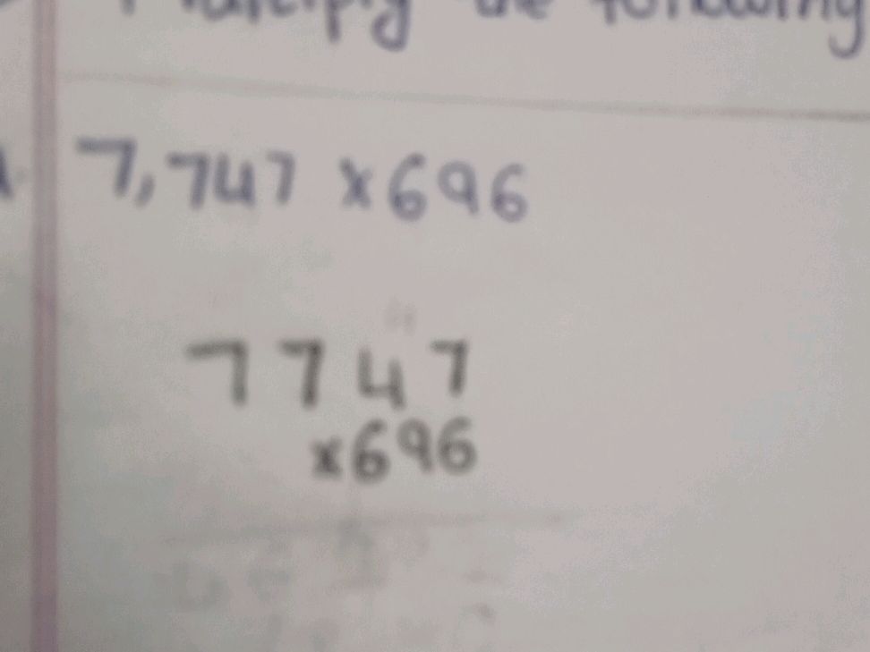 Multiplication of 7,747 and 696