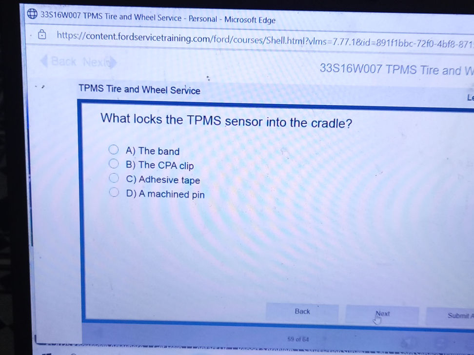 What locks the TPMS sensor into the cradle? | StudyX
